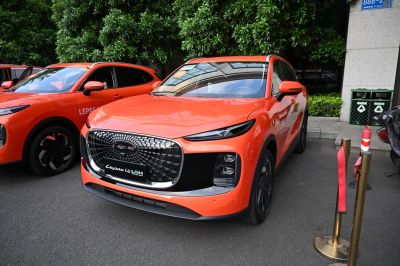 Orange SUV with distinctive front grille and LED headlights