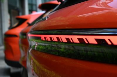 Close-up of a futuristic LED tail light on a sleek rear panel.