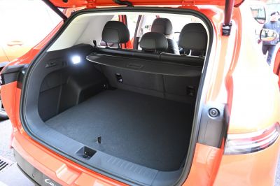 Open spacious rear trunk with visible rear seats and cargo cover