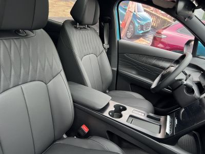 Leather front seats and modern center console with armrest