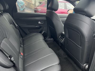 Spacious rear seat and door panel interior with upholstery and ventilation