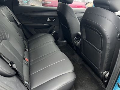 Black leather rear seats with rear air vents and USB ports.