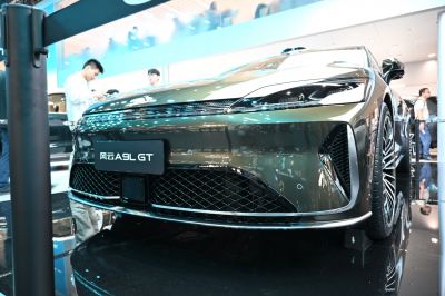 Close-up of sleek headlights and wide front grille