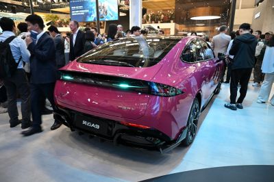 Sleek car rear with LED taillight strip and sporty diffuser.