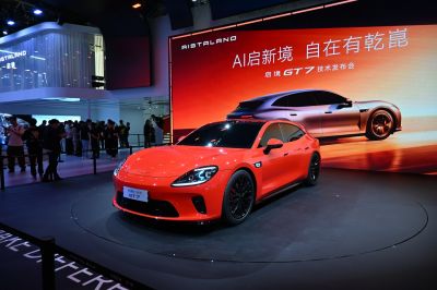 Sleek red hatchback with sporty design and black wheels