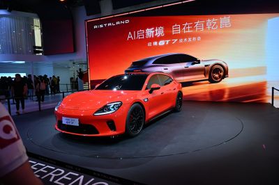 Red sporty hatchback with sleek aerodynamic design and black wheels