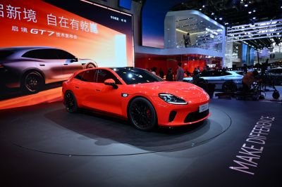 Red sports sedan with sleek design and black alloy wheels