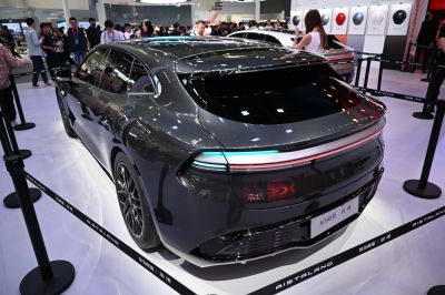 Rear view of sleek electric hatchback with panoramic roof and modern taillights