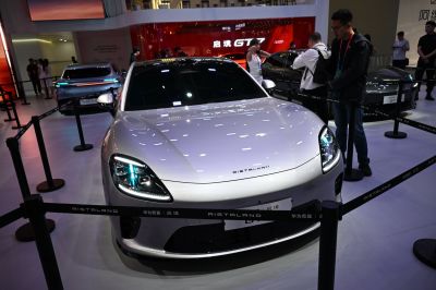 Sleek front view with LED headlights and smooth curved hood