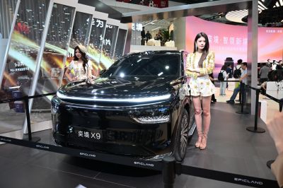 Ultra-wide LED headlights and sleek black SUV front view