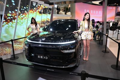 Front view of a black SUV with LED light bar and modern grille design