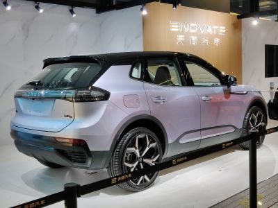 Rear and side view of an electric SUV with sleek design and taillights