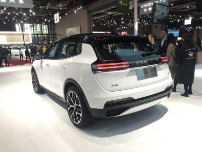 Rear view of a white SUV with LED light bar and sporty wheels