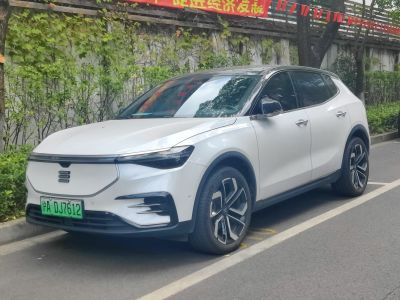 Electric SUV with sleek front, modern headlights, and alloy wheels