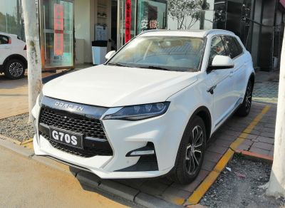 Front view of modern SUV with LED headlights and large grille