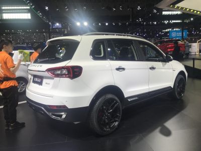 SUV rear-side view with taillights and black alloy wheels
