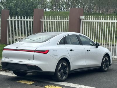 Rear LED light bar and flush door handles on aerodynamic electric sedan