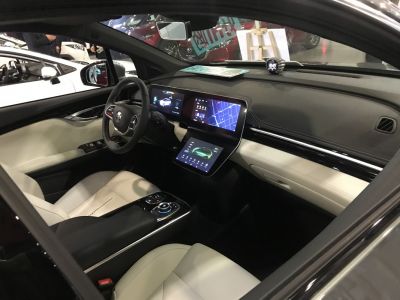Modern car interior with dual digital display panels and touchscreen controls