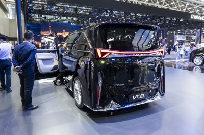 Rear view of modern vehicle with sleek LED tail light strip and wide rear window