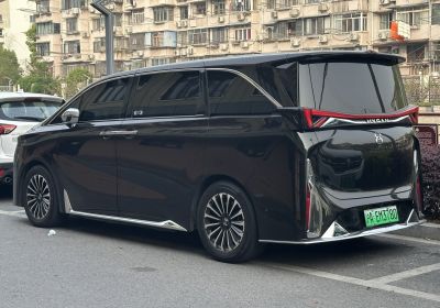 Rear and side view of futuristic electric minivan with aerodynamic design