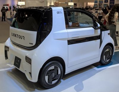 Compact electric microcar rear side view with futuristic design