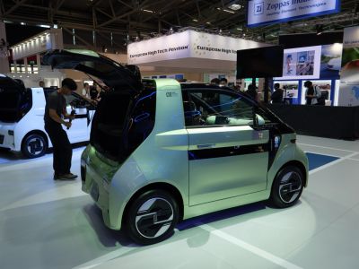 Compact electric vehicle with rear hatchback door and sleek design