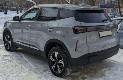 Rear and side profile with black roof and alloy wheels