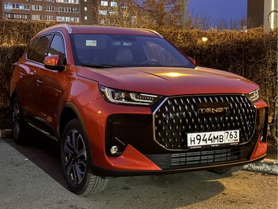 Modern SUV front with large black grille and sleek LED headlights