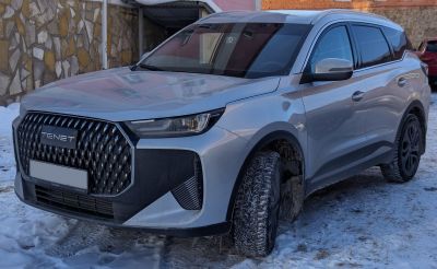 Modern SUV with large patterned grille and sleek angular headlights
