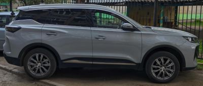 SUV side profile with alloy wheels and dark tinted windows