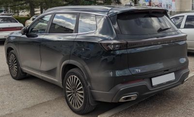 Rear view of an SUV with sleek taillights and dual exhaust integration