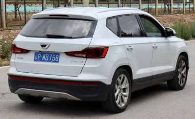 Rear and side profile showing taillights and alloy wheels.
