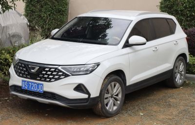 White compact SUV with front grille and LED headlights
