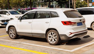 White SUV with angular taillights and black lower trim