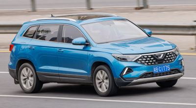 Blue SUV with distinctive grille and roof rails
