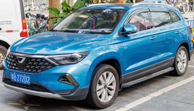 SUV front side with bold grille and sleek headlights in blue