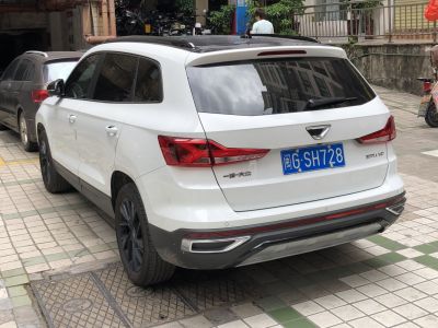 White SUV rear with angular taillights and tinted windows