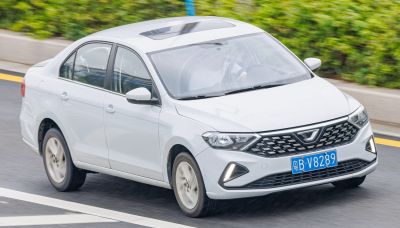 Front angle of sedan with diamond grille and LED daytime running lights