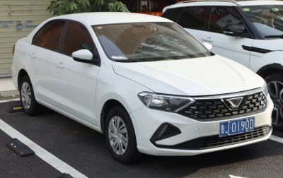 White sedan with distinctive angular headlights and front grille
