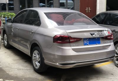 Rear view of a sedan with distinctive taillights and badges