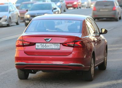 Distinctive sharp LED taillights and rear design of a sedan.