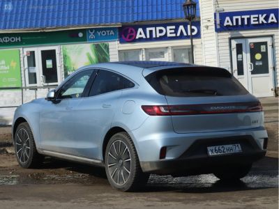 Rear-side profile of a modern hatchback with continuous rear light bar