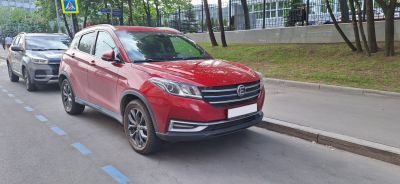 Front side view of compact SUV with sleek grille and headlight design