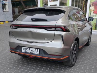 Rear view of electric SUV with LED taillights and sporty rear bumper