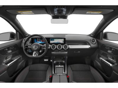 Digital dashboard, circular air vents, modern steering wheel