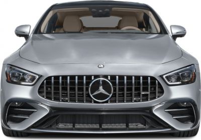 Front view with vertical slat grille and aggressive headlights.