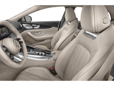 Beige leather seats with AMG branding and advanced center console controls
