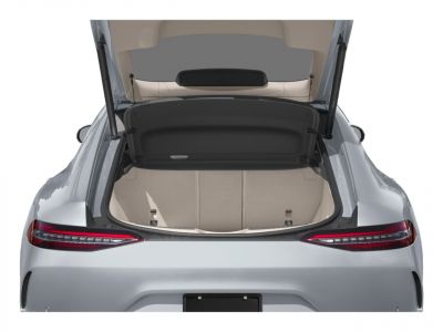 Open trunk of a modern luxury 4-door coupe with a spacious and clean cargo area