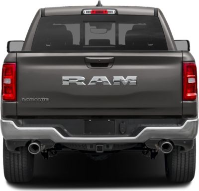 Rear view of RAM 1500 Quad Cab Short with dual exhaust and chrome bumper
