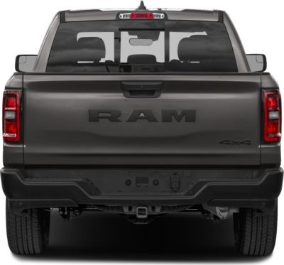 Rear view of pickup tailgate with RAM badge and 4x4 emblem